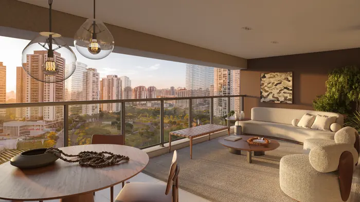 Sala com mesa redonda e sofá abertos para a varanda, com o parque e os prédios da cidade ao pôr do sol