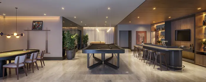 Lounge com bar e banquetas, mesa de sinuca ao centro e mesa de carteado junto à parede